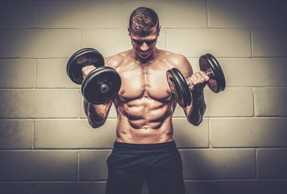 Fit Young Man Lifting Weights